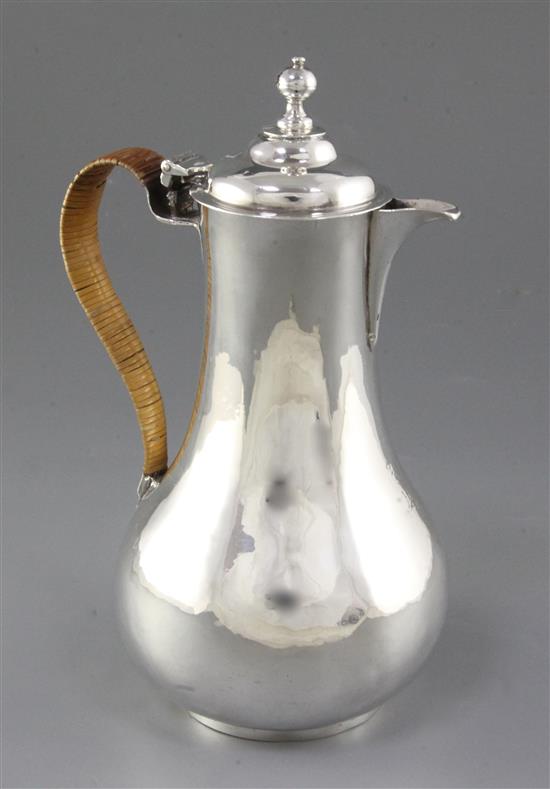 An Irish George III silver hot water pot, maker probably William Thompson, Height: 239mm gross weight: 14.7oz/460grms